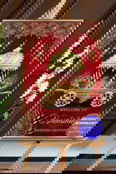 Royal Gold-Themed Wedding Welcome Banner with Ornate Chariot and Floral Accents on a Deep Red Background